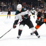 Arizona Coyotes defenseman Victor Soderstrom (77) and Anaheim Ducks forward Adam Henrique (14) vie for the puck during the second period of an NHL hockey game Wednesday, Sept. 29, 2021, in Anaheim, Calif.
