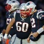 FOXBORO, MA - DECEMBER 04: David Andrews #60 of the New England Patriots talks with Tom Brady #12 during the second half against the Los Angeles Rams at Gillette Stadium on December 4, 2016 in Foxboro, Massachusetts.