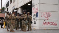National Guard faces off with protesters after arriving in L.A.