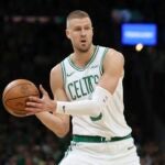Boston Celtics' Kristaps Porzingis plays against the Orlando Magic during the first half in game 1 of a first-round NBA playoff basketball series Sunday, April 20, 2025, in Boston.