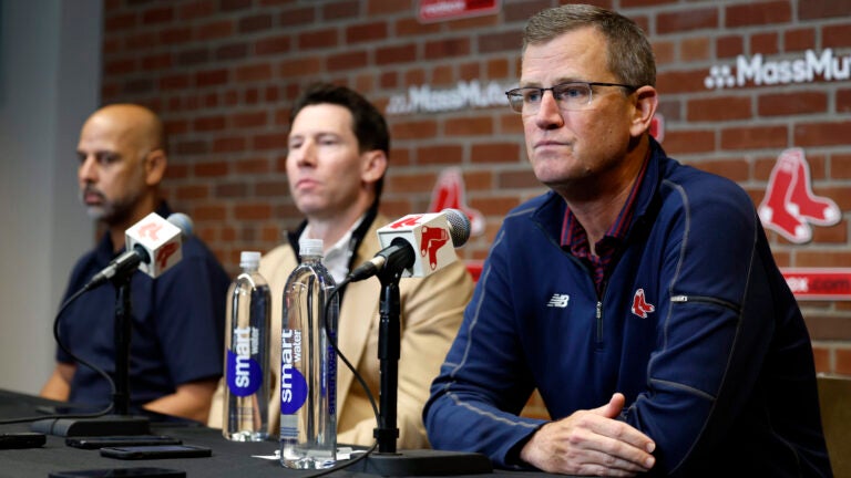 Sam Kennedy, president and CEO of the Boston Red Sox, Craig Breslow, chief baseball officer, and Alex Cora, team manager, sit during the end-of-season press conference at Fenway Park.