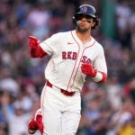 Red Sox rookie Marcelo Mayer points towards the dugout while rounding the bases on his solo home run during the second inning.