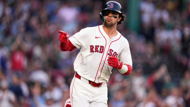 Red Sox rookie Marcelo Mayer points towards the dugout while rounding the bases on his solo home run during the second inning.