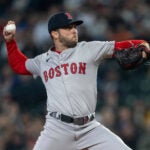 FILE - Boston Red Sox starter Kutter Crawford delivers a pitch against the Seattle Mariners during a baseball game, Saturday, March 30, 2024, in Seattle.