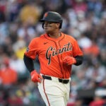 San Francisco Giants' Rafael Devers jogs to the dugout after grounding out against the Boston Red Sox during the first inning of a baseball game in San Francisco, Friday, June 20, 2025.