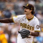 San Diego Padres starting pitcher Dylan Cease watches a Kansas City Royals batter connect on his throw in the first inning of a baseball game, Saturday, June 21, 2025, in San Diego.