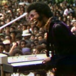 This image released by Searchlight Pictures shows Sly Stone performing at the Harlem Cultural Festival in 1969, featured in the documentary "Summer of Soul."