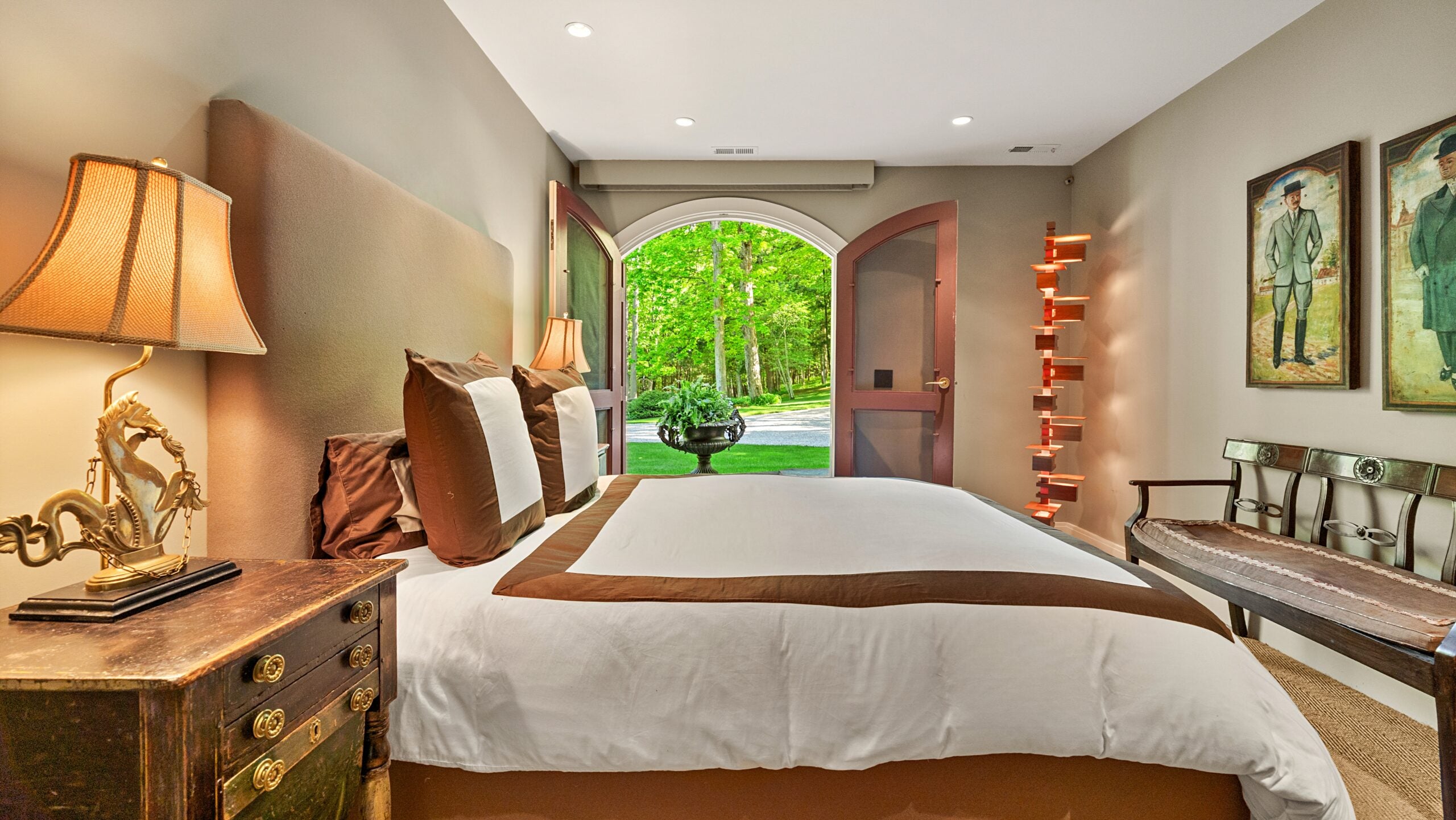 A bedroom opens out onto the grounds.