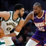 Boston Celtics forward Jayson Tatum (0) goes up against Phoenix Suns forward Kevin Durant (35) in the fourth quarter. The Celtics defeat the Suns, 127-112, at TD Garden.