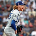 Los Angeles Dodgers starting pitcher Dustin May reacts after retiring the final Boston Red Sox batter of the fourth inning during a baseball game Sunday, July 27, 2025, in Boston