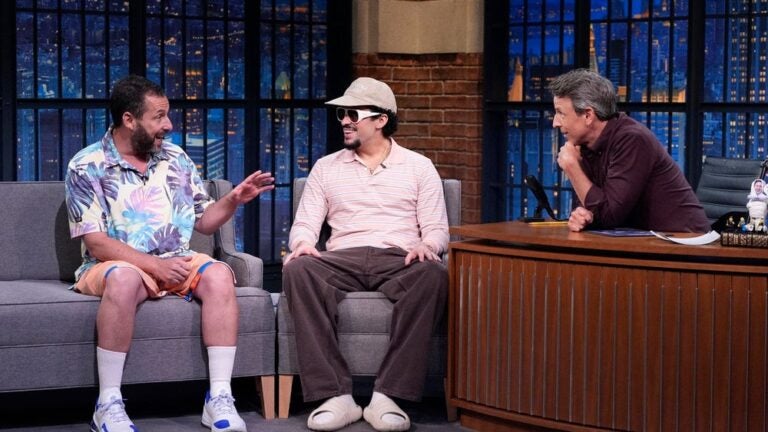 From left: Adam Sandler and Benito Antonio Martínez Ocasio on Tuesday's episode of "Late Night with Seth Meyers."