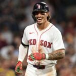 BOSTON, MASSACHUSETTS - JULY 08: Jarren Duran #16 of the Boston Red Sox reacts after hitting a solo home run against the Colorado Rockies during the seventh inning at Fenway Park on July 08, 2025 in Boston, Massachusetts.