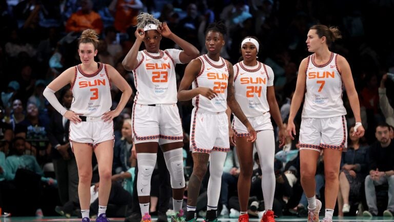 Connecticut Sun players (from left) Marina Mabrey, Kariata Diaby, Saniya Rivers, Aneesah Morrow, and Haley Peters couldn't do much more than watch in the third quarter when they were outscored by the host Liberty, 30-8.