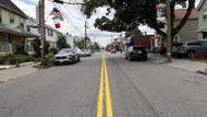 Newton paints over Italian flag traffic stripes before annual festival