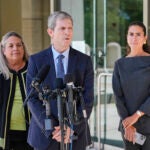 David Oscar Markus, attorney for Ghislaine Maxwell, center, speaks during a news conference outside the federal courthouse in Tallahassee, Fla., Thursday, July 24, 2025. Behind him is Leah Saffian, co-attorney, left, and Mellissa Madrigal, right.