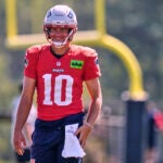 New England Patriots quarterback Drake Maye smiles at the team's NFL football training camp, Wednesday, July 30, 2025, in Foxborough, Mass.