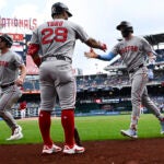Boston Red Sox's Trevor Story, right, celebrates after his two-run home run with Abraham Toro.