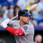 Boston Red Sox's Alex Bregman looks for the pitch before hitting an RBI single during the fifth inning of a baseball game against the Kansas City Royals, Saturday, May 10, 2025, in Kansas City, Mo.