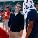 Boston Red Sox chief baseball officer Craig Breslow (center) talks to pitcher Brayan Bellow (second from right) and shortstop Ceddanne Rafaela (far right) during spring training at JetBlue Park.