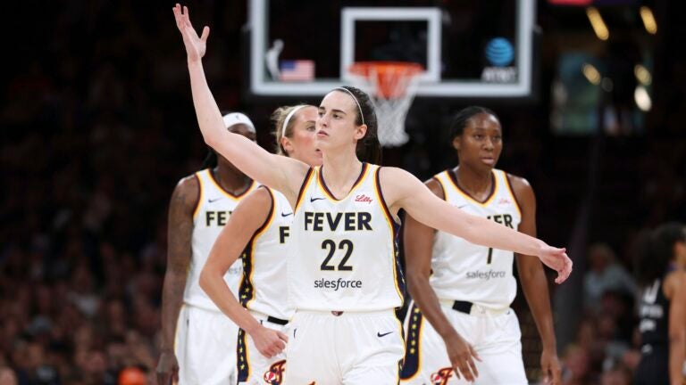 Caitlin Clark -- Indiana Fever's Caitlin Clark gestures to the crowd during the first half of a WNBA basketball game against the Connecticut Sun Tuesday, July 15, 2025, in Boston.