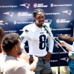 New England Patriots wide receiver Stefon Diggs (8) talks to reporters after day one of NFL training camp at Gillette Stadium on July 23, 2025.