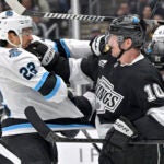 Tempers flair between Utah Hockey Club center Jack McBain, left, and Los Angeles Kings left wing Tanner Jeannot (10) during the third period of an NHL hockey game Saturday, Feb. 22, 2025, in Los Angeles.