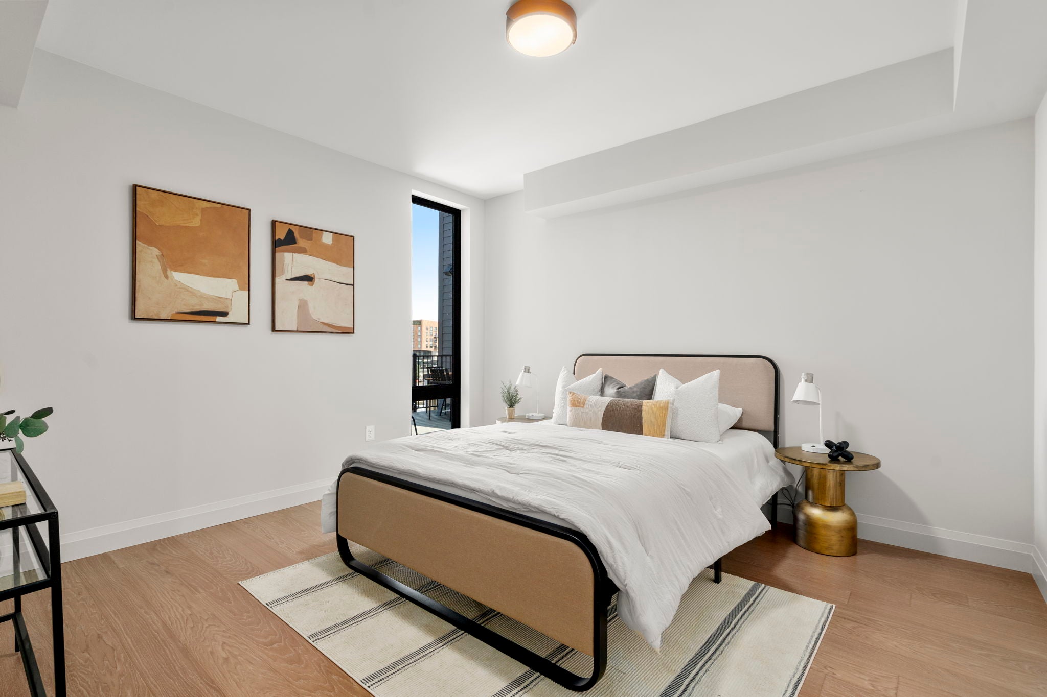 Like the rest of the condo, the secondary bedroom has hardwood floors. 
