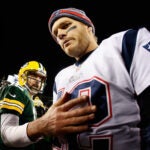 Quarterback Tom Brady #12 of the New England Patriots walks away from Aaron Rodgers #12 of the Green Bay Packers after shaking hands following the NFL game at Lambeau Field on November 30, 2014 in Green Bay, Wisconsin. The Packers defeated the Patriots 26-21.