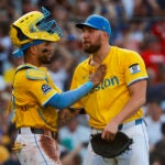 Boston Red Sox catcher Carlos Narvaez (75) and Boston Red Sox starting pitcher Garrett Crochet (35) embrace following the win. The Boston Red Sox host the Tampa Bay Rays Saturday, July 12, 2025 at Fenway Park in Boston, MA.