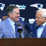 New England Patriots owner Robert Kraft (right) pats the back of former head coach Bill Belichick after he addressed the media at Gillette Stadium about his departure.