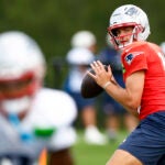 Patriots quarterback Drake Maye (10) looks to throw during NFL training camp at Gillette Stadium on Aug. 25, 2025.