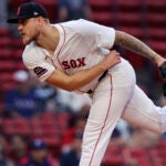 Boston Red Sox pitcher Tanner Houck throws during the first inning of a baseball game against the Texas Rangers on Wednesday, May 7, 2025, in Boston.