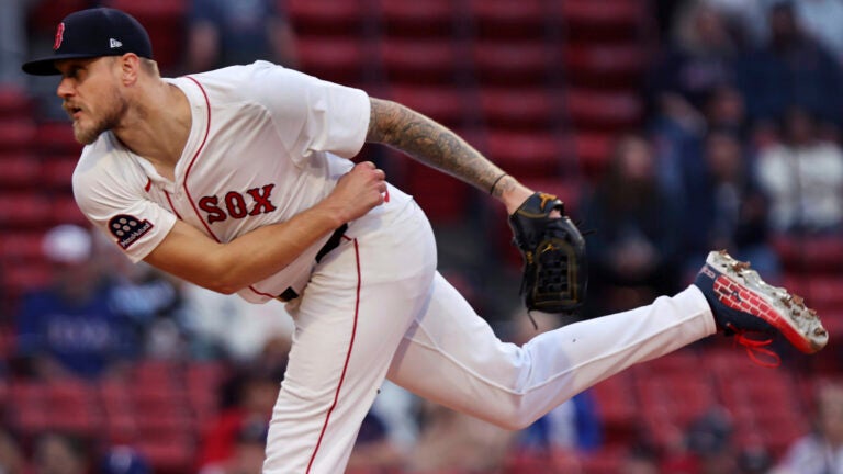 Boston Red Sox pitcher Tanner Houck throws during the first inning of a baseball game against the Texas Rangers on Wednesday, May 7, 2025, in Boston.