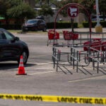 Evidence is seen marked as law enforcement investigates a shooting at Target off Research Boulevard, in Austin, Texas, Monday, Aug. 11, 2025.