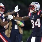 FOXBOROUGH, MASSACHUSETTS - SEPTEMBER 10: Demario Douglas #81 of the New England Patriots celebrates with Kendrick Bourne #84 of the New England Patriots after Bourne's touchdown reception during the fourth quarter against the Philadelphia Eagles at Gillette Stadium on September 10, 2023 in Foxborough, Massachusetts.