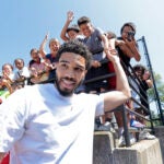 Jayson Tatum excites the kids outside the building to be renovated into the Manton Heights Early Education Center, after a groundbreaking in Providence, RI on Thursday August 7, 2025. The renovation of the Manton Heights public housing complex is being undertaken by the Boston Celtics Shamrock Foundation, Amica, and the Providence Housing Authority.