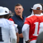 Coach Mike Vrabel calls his players together as the New England Patriots held training camp at their facility at Gillette Stadium on Thursday.