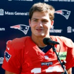 New England Patriots quarterback Drake Maye (10) talks to reporters after NFL training camp at Gillette Stadium on Aug. 25, 2025.
