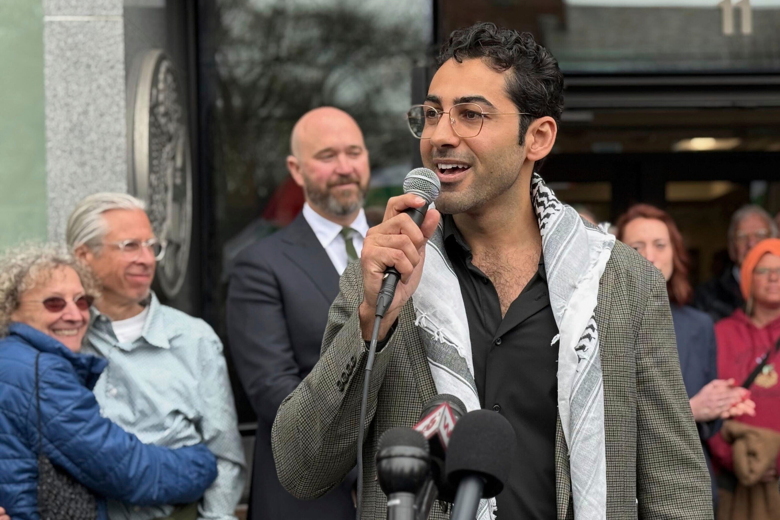 Mohsen Mahdawi speaks outside the courthouse. 