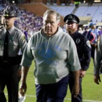 North Carolina head coach Bill Belichick, front, walks off the field after his team lost to TCU in an NCAA college football game Monday, Sept. 1, 2025, in Chapel Hill, N.C.