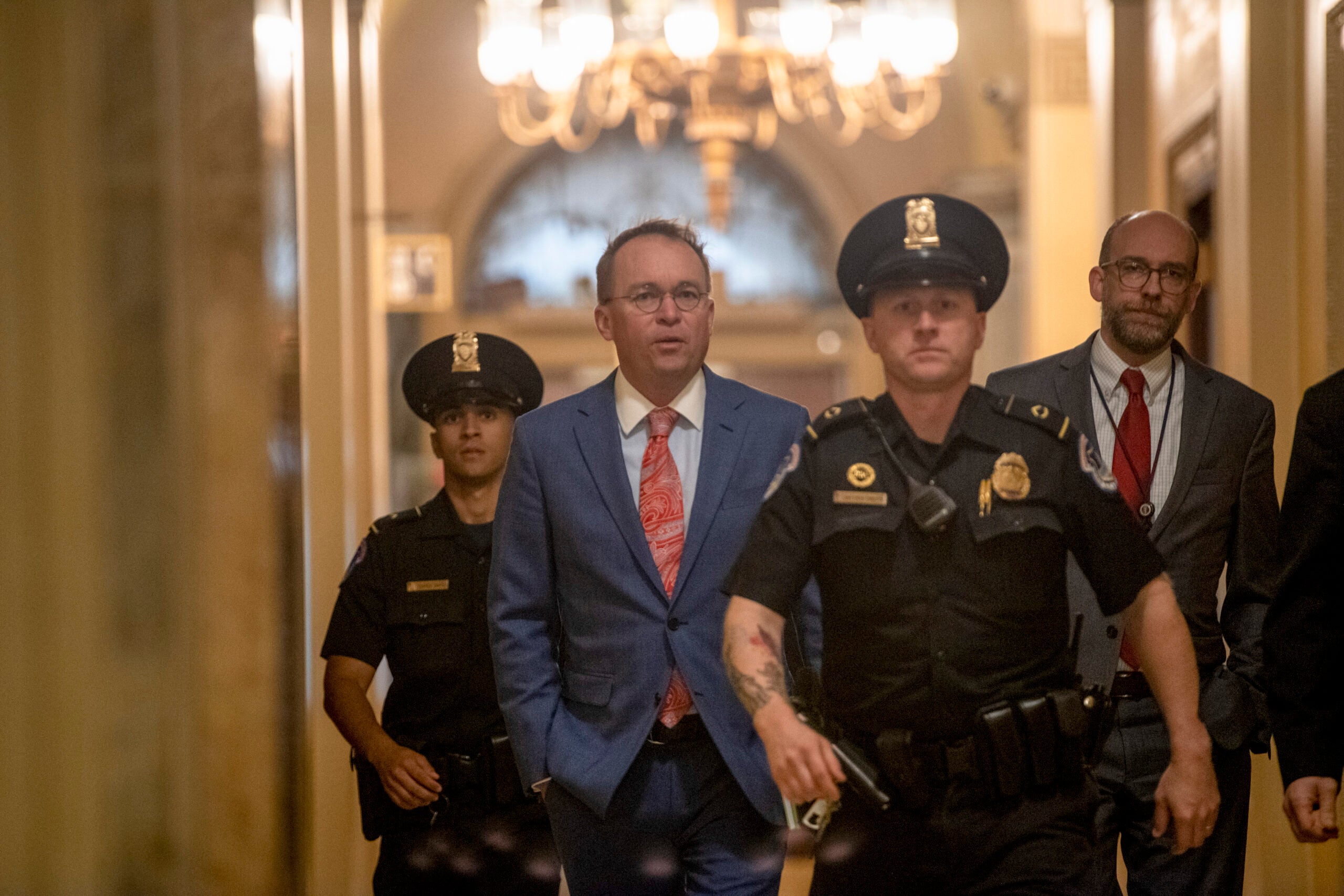 Mick Mulvaney, the acting White House chief of staff, and Russell Vought.