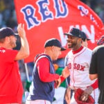 Aroldis Chapman #44 of the Boston Red Sox with manager Alex Cora after they defeated the Pittsburgh Pirates 5-2 during MLB action at Fenway Park on Saturday August 30, 2025.