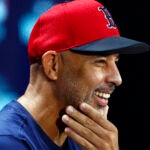 Boston Red Sox manager Alex Cora (13) smiles during a press conference before Game 2 of the Wild Card playoff series at Yankee Stadium on Oct. 1, 2025, in New York.