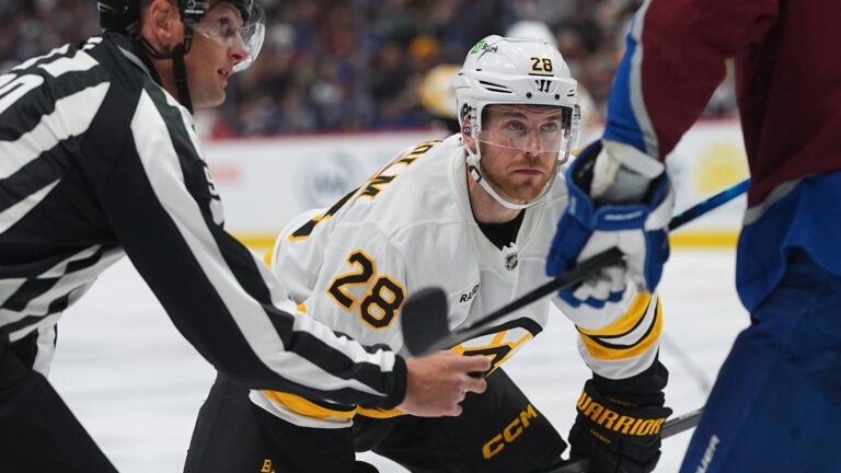 Boston Bruins center Elias Lindholm (28) waits for a face off in the second period of an NHL hockey game against the Colorado Avalanche Saturday, Oct. 18, 2025, in Denver.