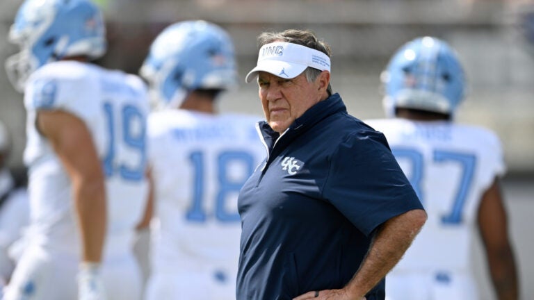North Carolina head coach Bill Belichick looks on as players warm up before an NCAA football game against Central Florida, Saturday, Sept. 20, 2025, in Orlando, Fla.