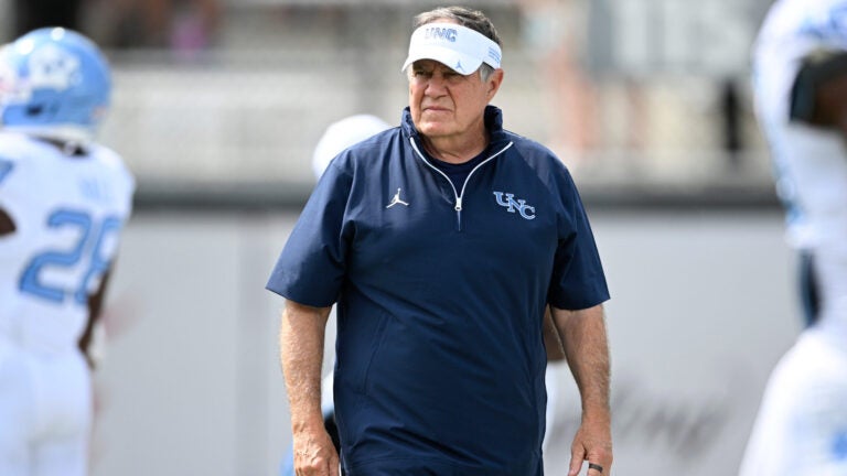 North Carolina head coach Bill Belichick looks on as players warm up before an NCAA football game against Central Florida, Saturday, Sept. 20, 2025, in Orlando, Fla.