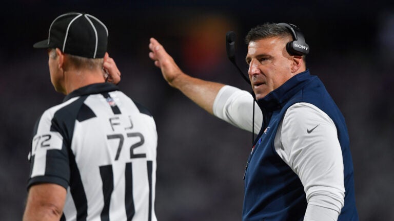 New England Patriots head coach Mike Vrabel, right, talks with field judge Jason Ledet during the second half of an NFL football game against the Buffalo Bills in Orchard Park, N.Y., Sunday, Oct. 5, 2025.