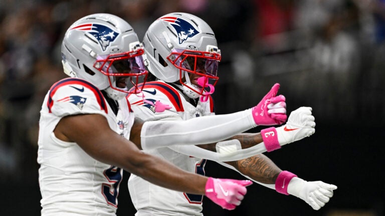 New England Patriots wide receiver Demario Douglas (3) celebrates his touchdown in the first quarter with teammate wide receiver Kayshon Boutte (9) during an NFL football game against the New Orleans Saints, Sunday, Oct. 12, 2025, in New Orleans.