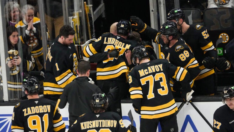 Boston Bruins center Elias Lindholm (28) is assisted off the ice after suffering an injury during the 2nd period. The Boston Bruins host the Buffalo Sabres Thursday, October 30, 2025 at TD Garden in Boston, MA.