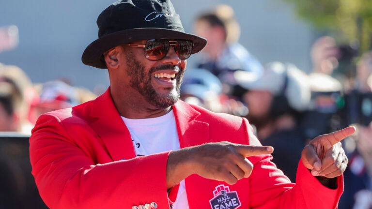Foxborough MA September 20, 2025 Former Patriots Hall of Fame player Ty Law greets the crowd during the New England Patriots Hall of Fame ceremony inducting former coach Bill Parcells and fan favorite Julian Edelman at Patriot Place Plaza on Saturday September 20, 2025.
